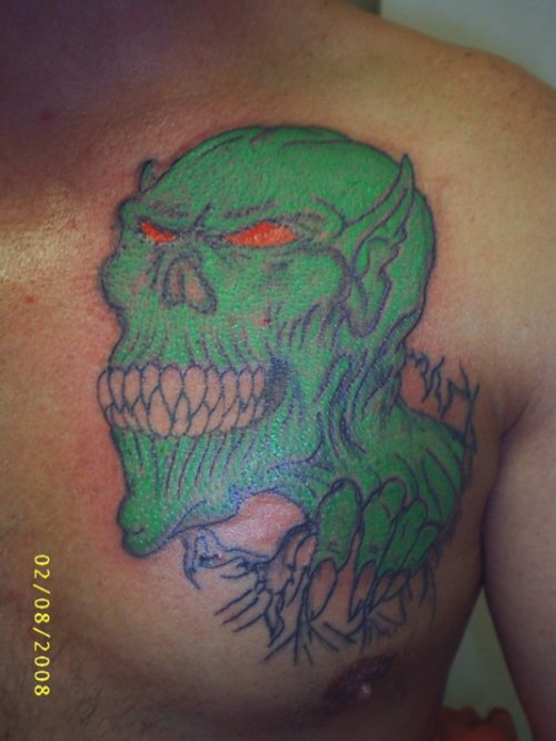 Green Ink Goblin Tattoo On Man Chest