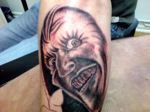 Grey Ink Goblin Tattoo On Left Sleeve