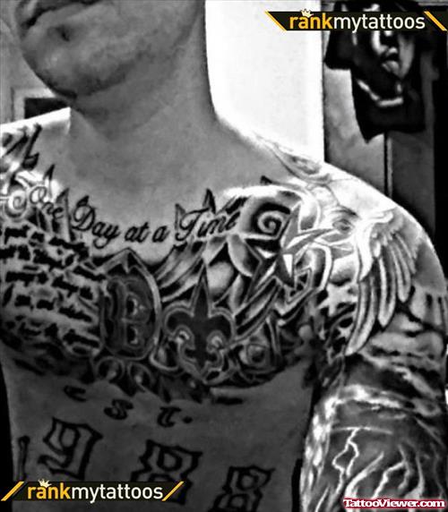 Grey Ink Gothic Tattoo On Guy chest