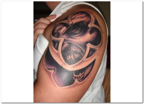 Grey Ink Gothic Tattoo On Man Left Sleeve