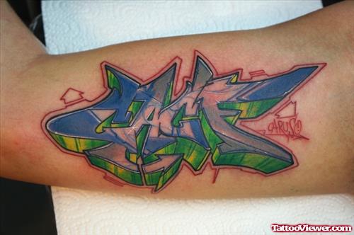 Color Ink Graffiti Tattoo On Biceps