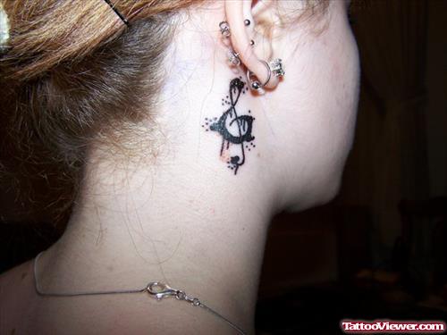 Graffiti Tattoo On Girl Behind Ear