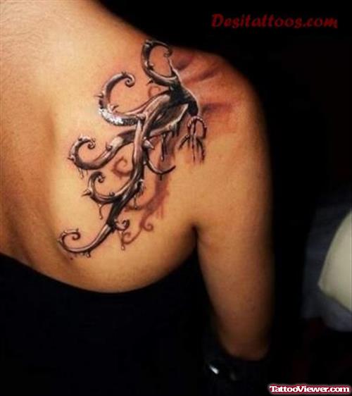 Grey Ink Graffiti Tattoo On Right Back SHoulder For Girls