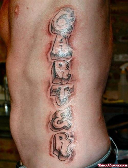 Grey Ink Graffiti Tattoo On Man Left Side Rib