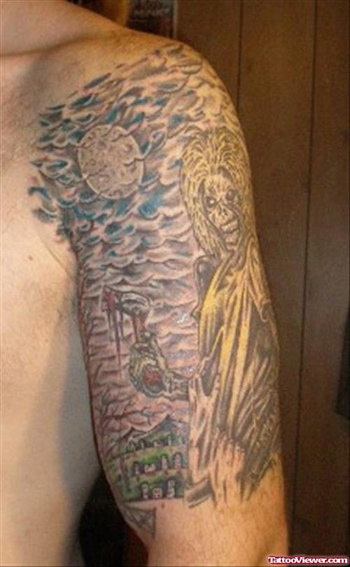 Beautiful Grey Ink Graveyard Tattoo On Man Left Half Sleeve