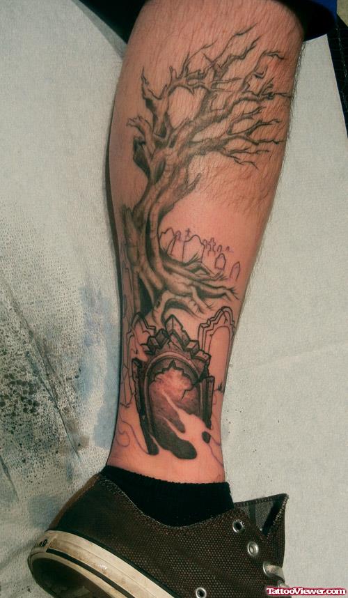 Grey Ink Graveyard Tree Tattoo On Right Leg