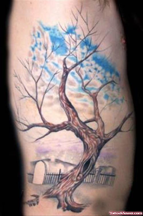 Clouds And Tree Tattoo On Rib
