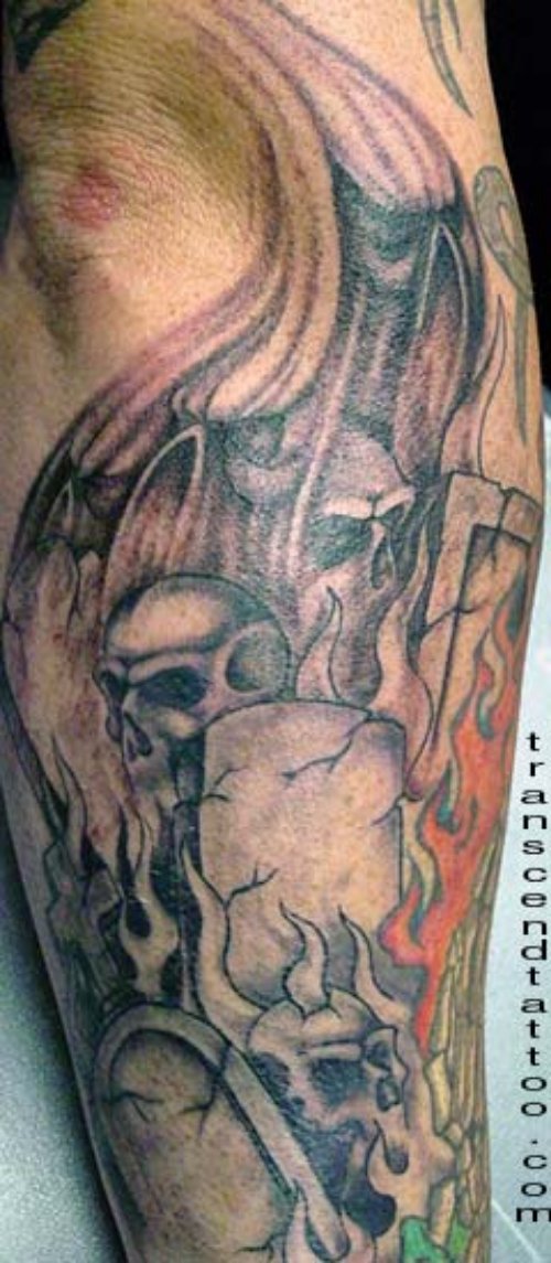 Grey Ink Skulls Graveyard Tattoo On Sleeve