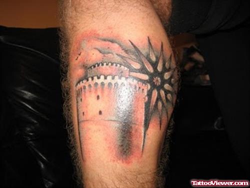Grey Ink Greek Tattoo On Left Leg