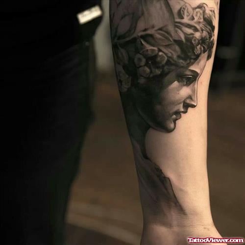 Grey Ink Greek Tattoo On Left Forearm