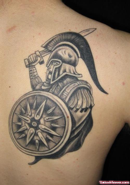 Grey Ink Ancient Greek Tattoo On Right Back Shoulder