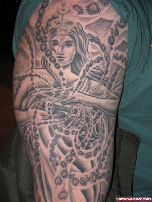 Grey Ink Greek Tattoo On Man Right Sleeve