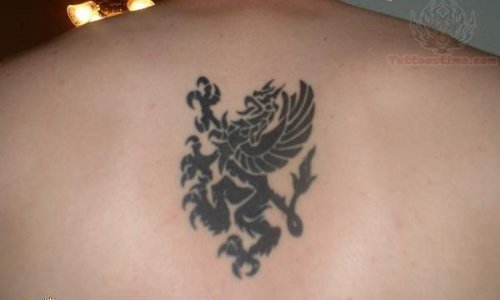 Tribal Griffin Tattoo On Upper Back
