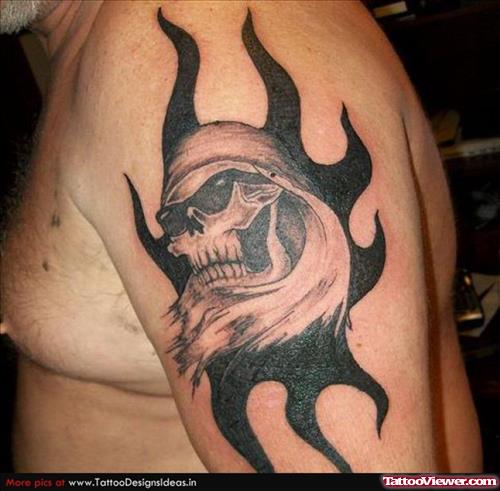 Black Tribal And Grey Grim Reaper Tattoo On Bicep