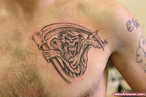 Awesome Grim Reaper Tattoo On Man Chest. 