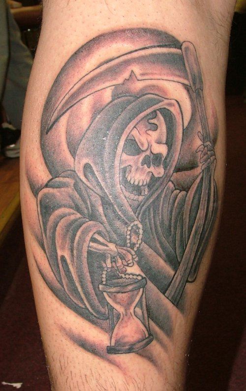 Grey Ink Grim Reaper Tattoo On Back Leg
