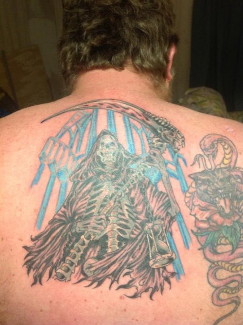 Color Ink Grim Reaper Tattoo On Back