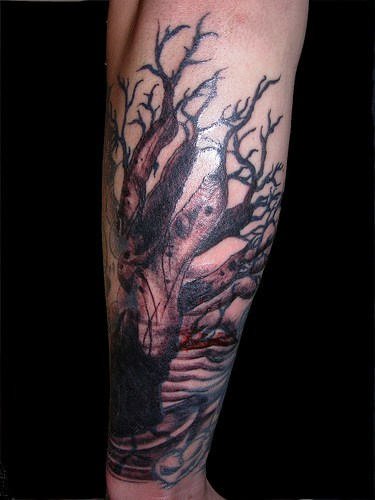 Tree And Grim Reaper Tattoo On Arm