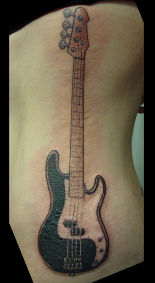 Guitar Tattoo on Girl Side Rib