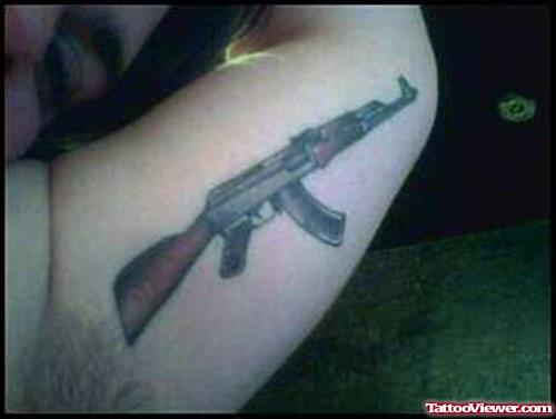 Gun Tattoo On Left Half Sleeve