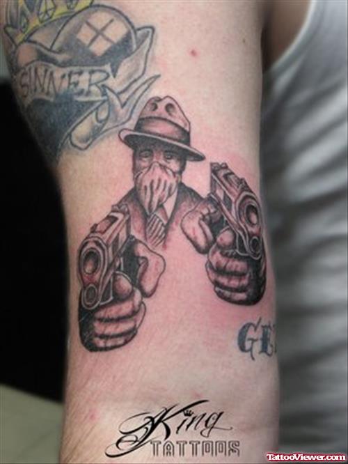 Gangster With Guns Tattoos On Bicep
