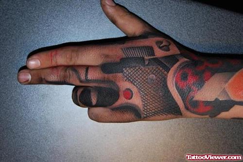 Dark Ink Gun Tattoo On Left Hand