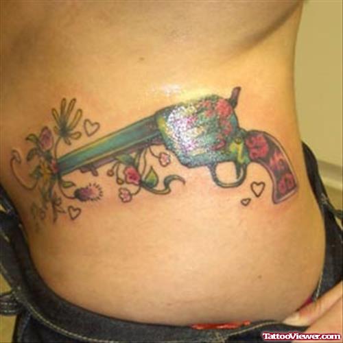 Color Flowers and Gun Tattoo On Side