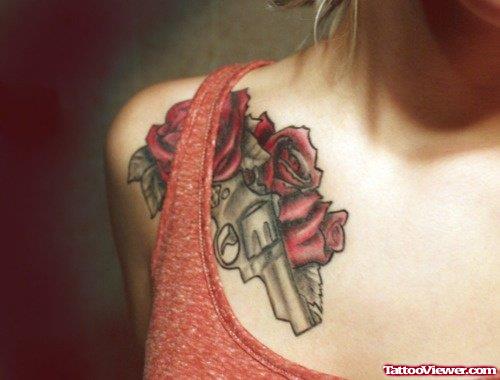 Red Rose And Pistol Tattoo On Right Shoulder