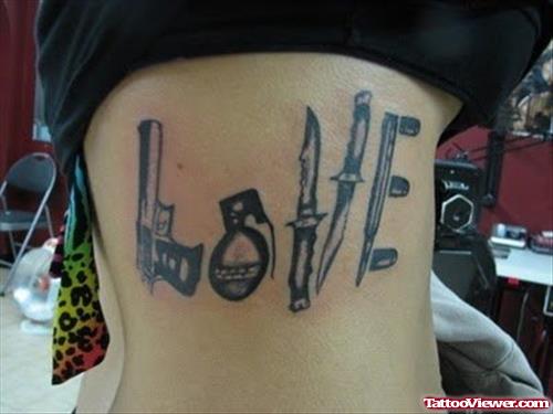 Love Gun Tattoo On Rib Side