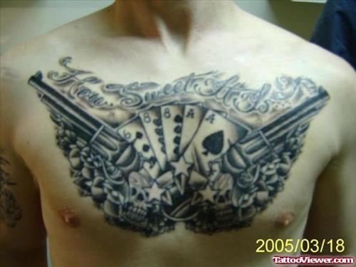 Grey Ink Cards And Gun Tattoos On Man Chest