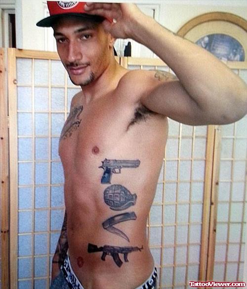 Grey Ink Love Gun Tattoo On Side Rib