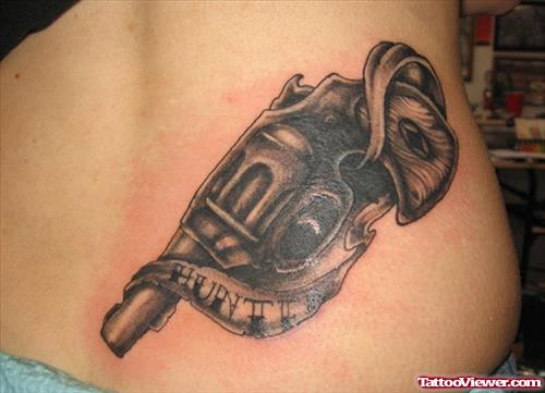 Awesome Grey Ink Gun Tattoo On Girl Lowerback