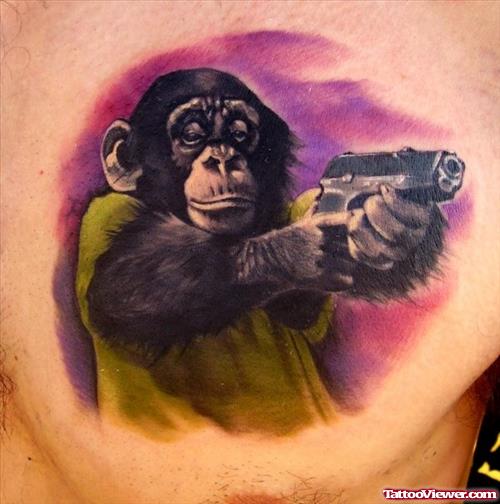 Colored Ape With Gun Tattoo On Man Chest