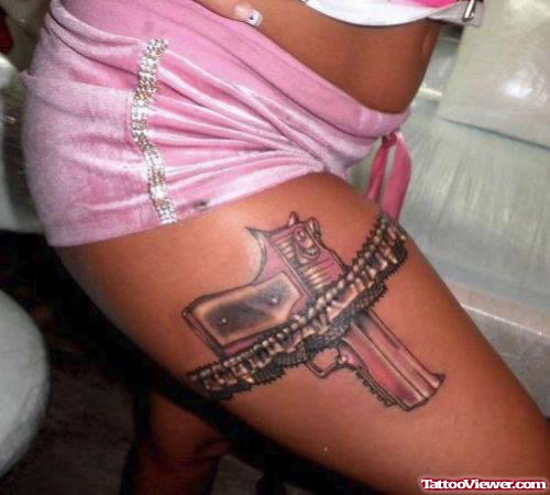 Garter And Lace Gun Tattoo On Girl Right Thigh