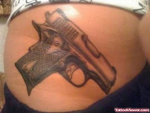 Amazing Grey Ink Gun Tattoo On Hip