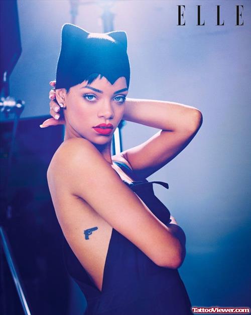 Rihanna Gun Tattoo On Side