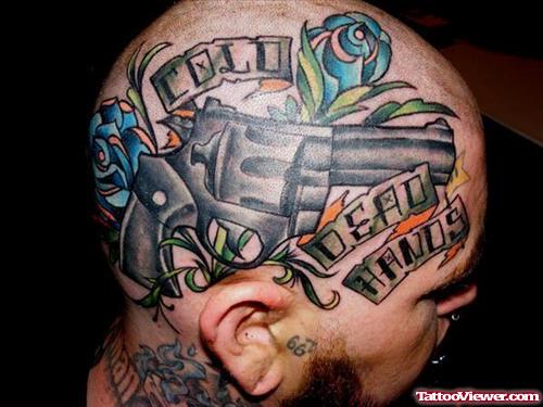Banner and Gun Tattoo On Man Head