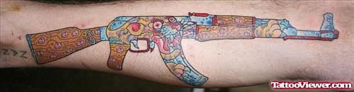Colored Ak47 Gun Tattoo On Leg