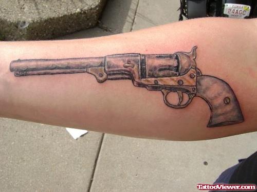 Attractive Grey Ink Gun Tattoo On Arm