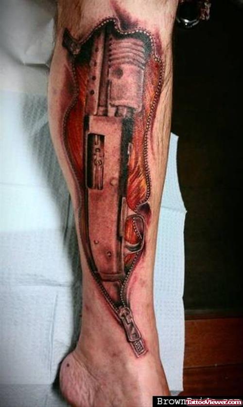 Ripped Skin Gun Tattoo On Leg