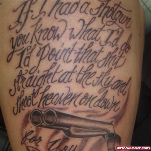 Grey Ink Lettering and Gun Tattoo