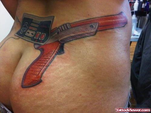 Game Remote And Gun Tattoo On Lowerback