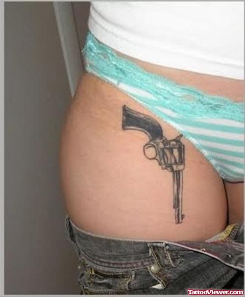 Black Gun Tattoo On Girl Thigh