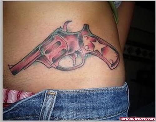 Red Gun Tattoo On Hip