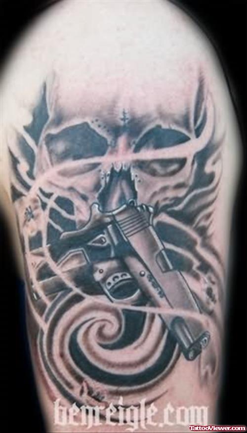 Skull And Gun Tattoo On Shoulder