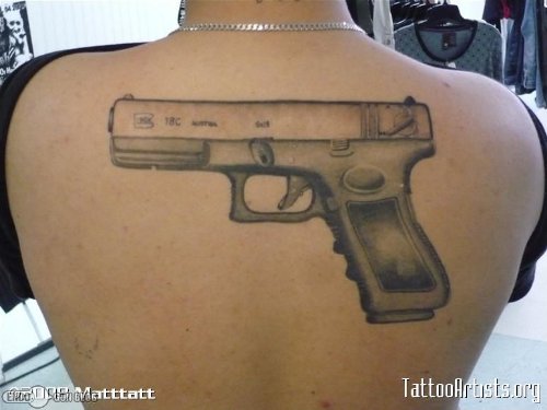 Grey Ink Gun Tattoo On Back Body
