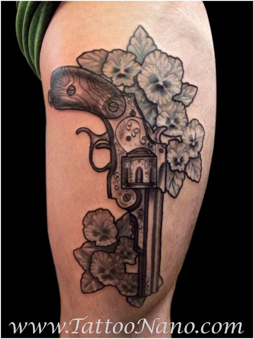 Grey Ink Flowers And Gun Tattoo On Half Sleeve
