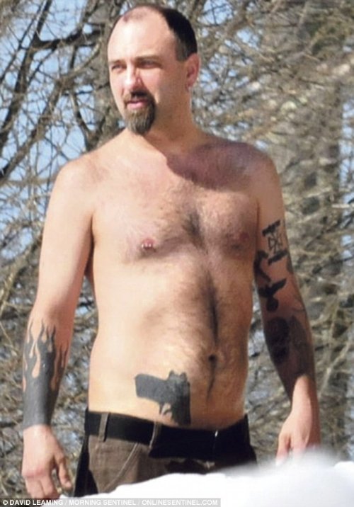 Man With Gun Tattoo On Hip