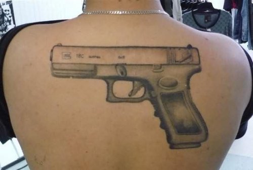 Big Gun Tattoo On Back