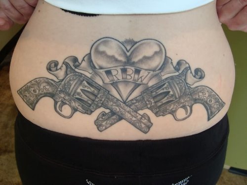 Heart And Guns Tattoos On Back Waist